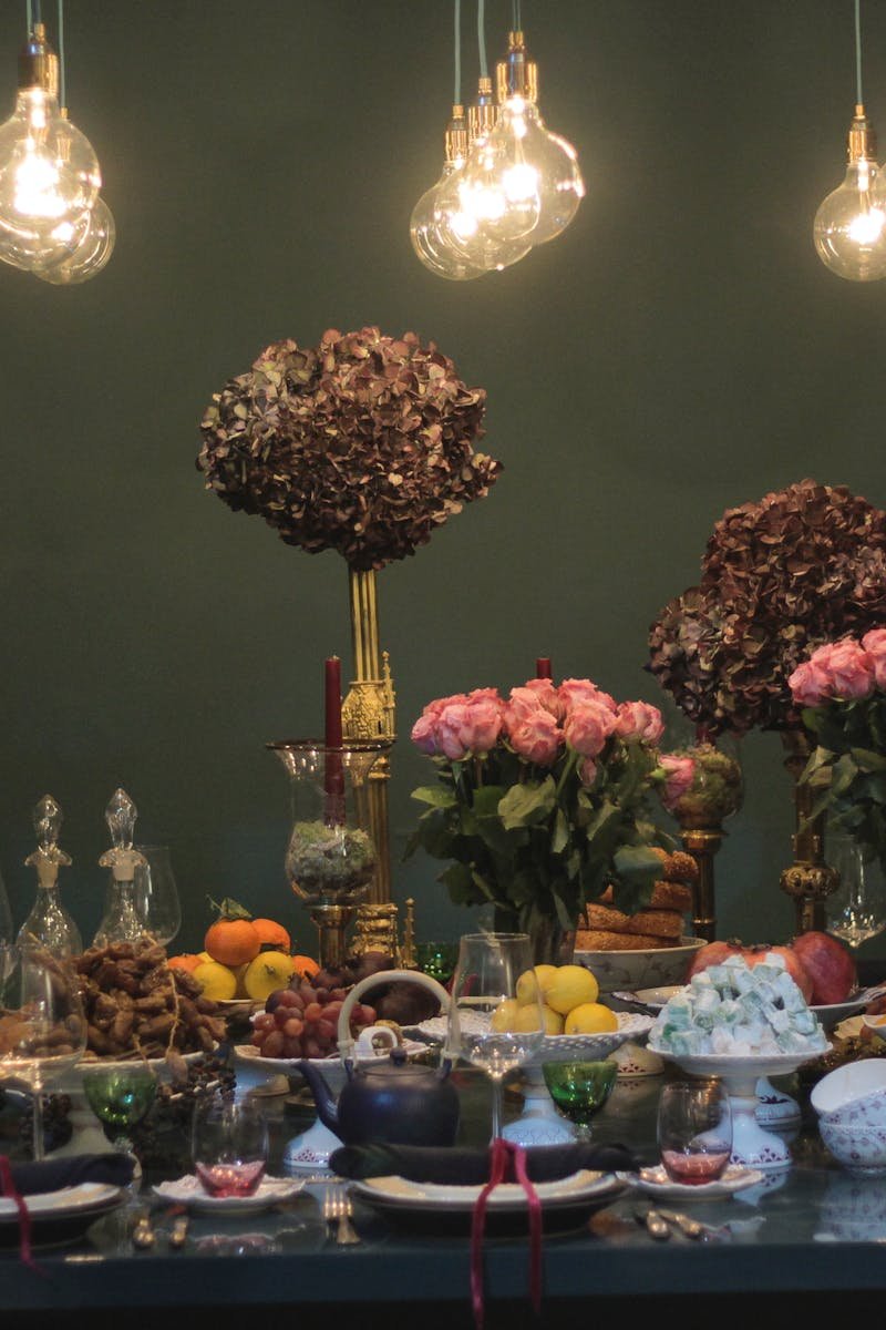 Luxurious dining setting with flowers and ambient lighting perfect for celebrations.